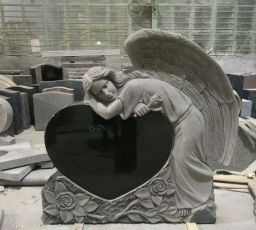 Weeping sculpted angel on single jet black hear